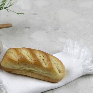 Neolith Retrostone used as a table setting background with bread and decor
