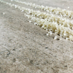 Neolith Concrete Taupe with scattered salt grains