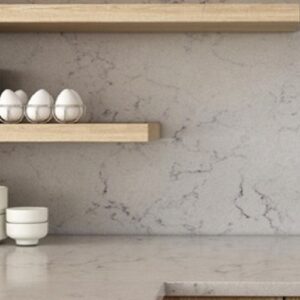 Kitchen shelf with Unistone Valley White Quartz backsplash in a modern setting