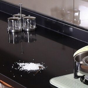 Unistone Nero Assoluto quartz kitchen worktop with modern appliances in London