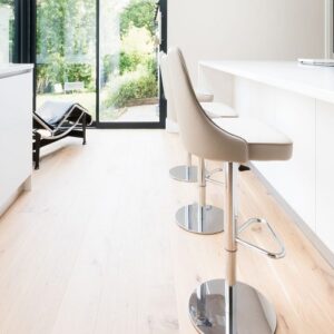 Stylish kitchen island with CRL White Water Quartz in a bright UK interior