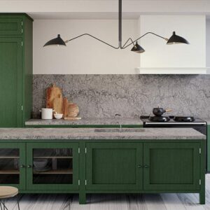 Stylish kitchen featuring Caesarstone Turbine Grey Quartz worktops and green cabinetry.