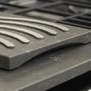 Quartzforms Fossil Jet worktop installed in a modern kitchen setting