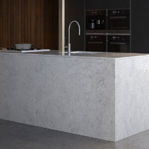 Elegant kitchen island featuring Unistone Naxos Quartz surface.