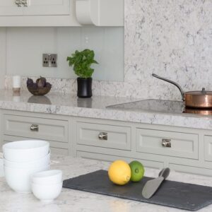 Modern kitchen in London featuring CRL River White Quartz worktops.