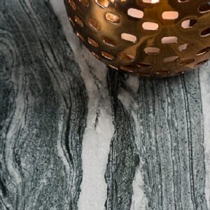 Decorative candle holder on Neolith Mar Del Plata surface in a London home.