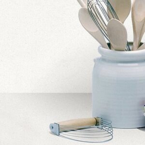 CRL Chalk Quartz worktop with kitchen utensils in Surrey setting