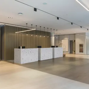 Modern reception area featuring CRL Venetian Grande Quartz countertops in London, UK