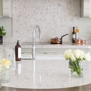 Elegant kitchen design in Surrey with CRL River White Quartz surfaces.