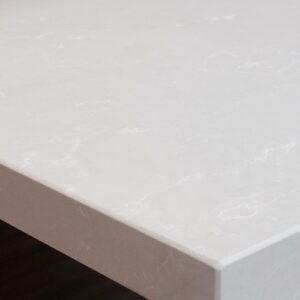 Detailed view of Unistone Botticino quartz, showcasing its smooth texture and marble-like appearance.