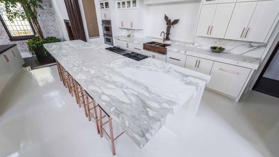Flooring Modern kitchen featuring Calacatta Bettogli Marble countertops in a spacious layout