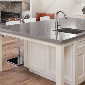 Cambria Carrick Quartz kitchen island with sink in a stylish UK home.