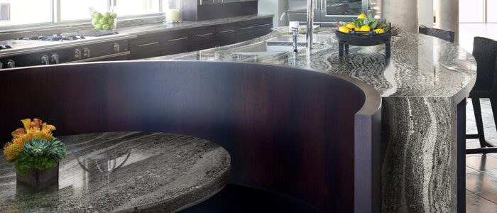 Tiles & Walls Curved Cambria Roxwell Quartz countertop in a contemporary kitchen setting.
