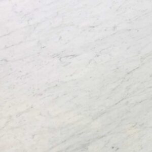 Close-up of Bianco Carrara Extra Marble surface with classic veining.