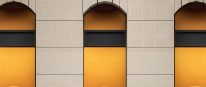 Flooring Compac Travertine Composite Stone used in modern architectural design with orange accents.