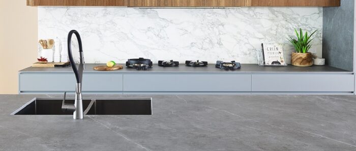Flooring Modern kitchen featuring Laminam Pietra Grey worktop in a stylish setting.