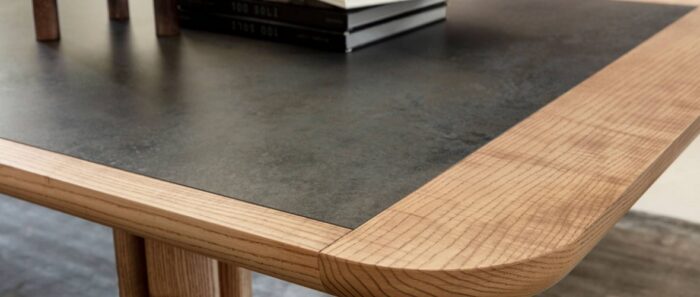 Tiles & Walls Corner view of Laminam Nero ceramic table with wooden edge in a Surrey home