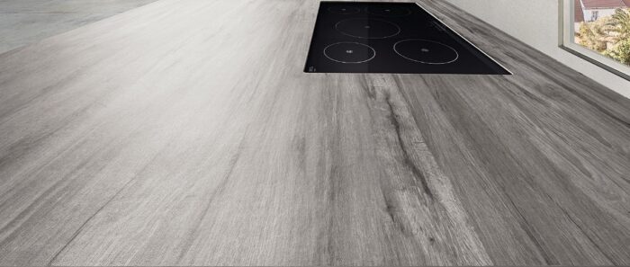 Flooring Laminam Legno Venezia Fumo kitchen countertop with integrated hob