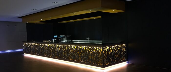 Flooring Luxurious bar counter with Magna Glaskeramik Champagne Brown surface in a modern setting, London UK