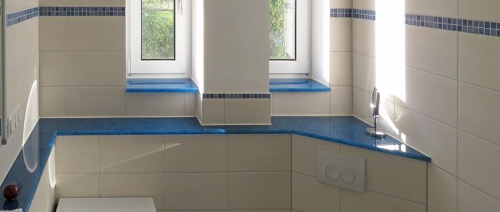 Tiles & Walls Bathroom with blue Magna Glaskeramik Ocean Blue window sills and accents.