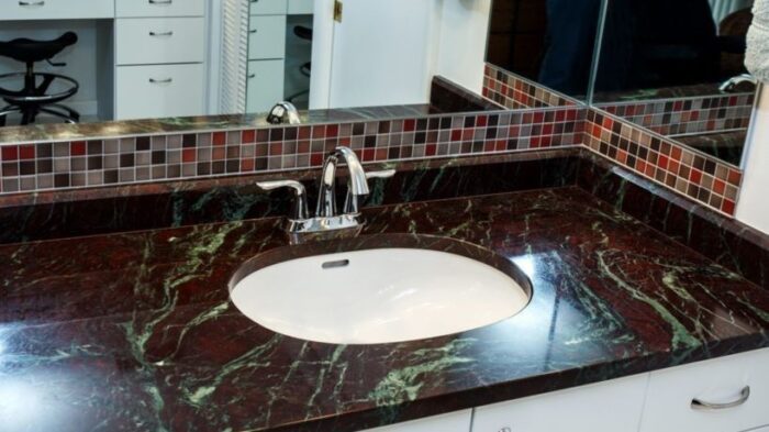 Flooring Moulin Rouge Quartzite countertop in a modern bathroom setting