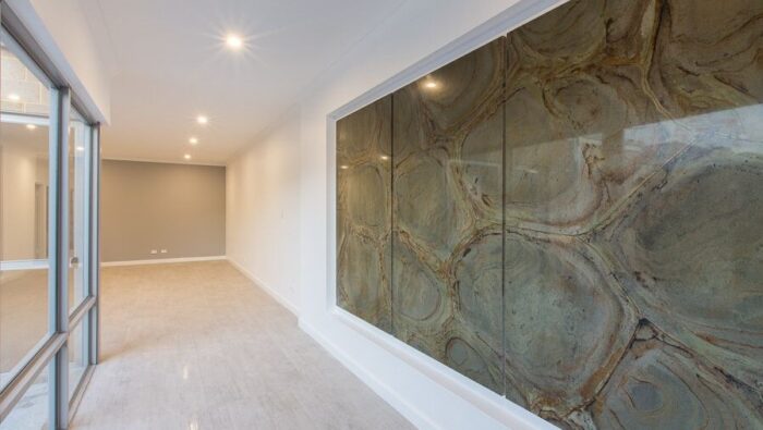 Flooring Interior view featuring Green Turtle Quartzite wall in a modern London home.