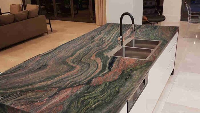 Flooring Capolavoro Quartzite kitchen island in a modern setting
