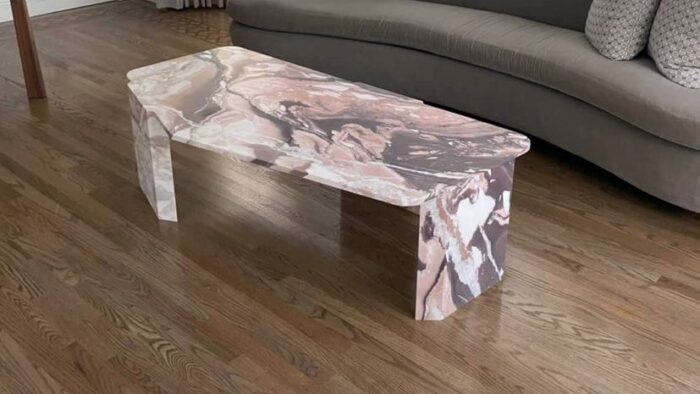 Flooring Calacatta Vagli Rosato Marble table in a stylish living room
