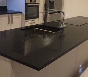 Kitchen with Unistone Black Crystal Quartz worktop in modern design