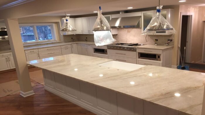 Flooring Luxurious kitchen featuring a Mother Of Pearl Quartzite island in London