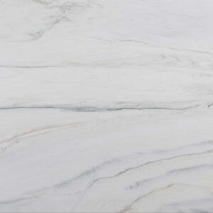 Close-up of Bianco Lasa Marble with creamy white background and golden veining.