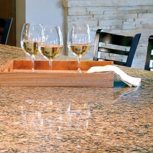 Cambria Canterbury Quartz worktop with wine glasses in a stylish kitchen