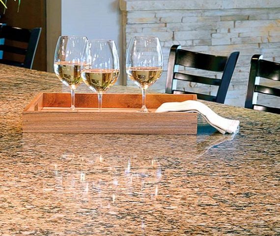 Flooring Cambria Canterbury Quartz worktop with wine glasses in a stylish kitchen