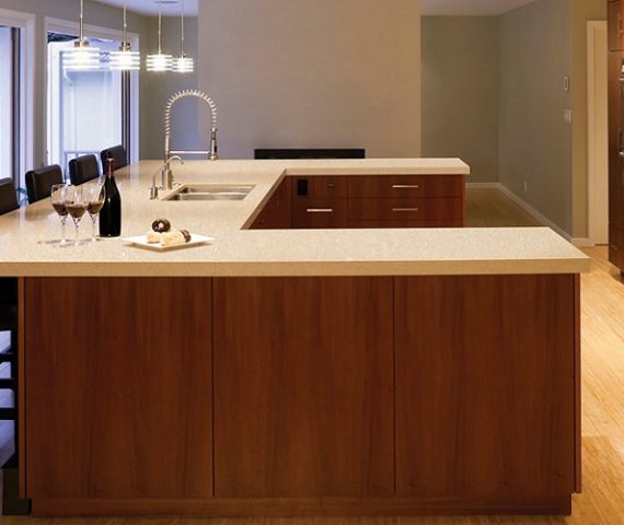 Flooring Modern kitchen with Cambria Fairbourne Quartz countertops in a spacious layout