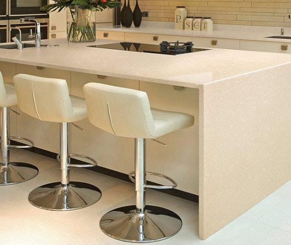 Tiles & Walls Stylish kitchen island featuring Cambria Fairbourne Quartz with bar stools