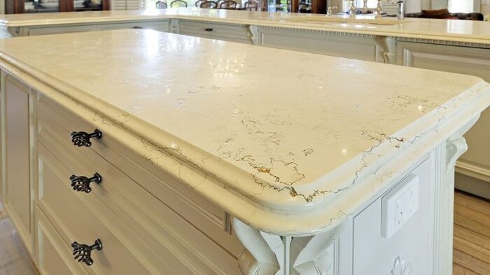 Flooring Bianco Perlino Marble worktop with cream backdrop and grey veins in a classic kitchen setting in London, UK.