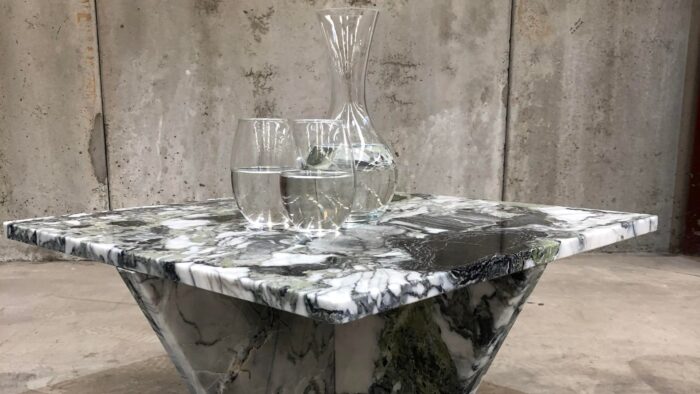 Flooring Elegant table made from Primavera Marble with water glasses in an industrial setting