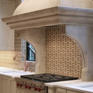 Traditional kitchen with Perla Venata Quartzite surfaces and intricate tile backsplash.