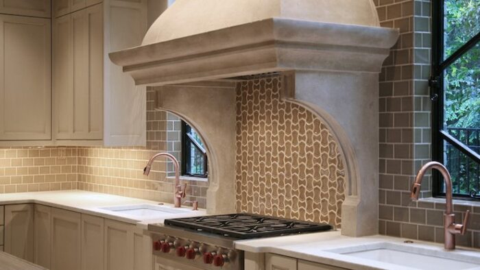 Tiles & Walls Traditional kitchen with Perla Venata Quartzite surfaces and intricate tile backsplash.