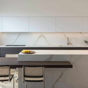 Modern kitchen in London featuring Laminam Calacatta Oro Venato worktop