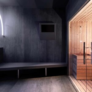 Contemporary sauna interior featuring Laminam Pietra Di Savoia Antracite surfaces.