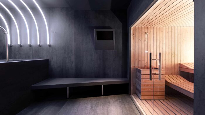 i-naturali-pietra-di-savoia-antracite-laminam-04-825d5000-4a3c-11ed-9357-0dc1e03c9bd0 Contemporary sauna interior featuring Laminam Pietra Di Savoia Antracite surfaces.