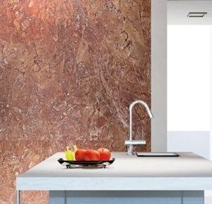Modern kitchen featuring Olympia Red Marble wall in London home