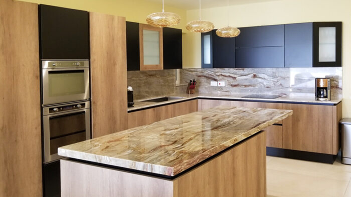 Flooring Modern kitchen featuring Nacarado Quartzite worktops in London