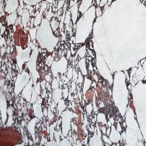 Close-up of Calacatta Vagli Rosato Marble with rose patches and dark veins