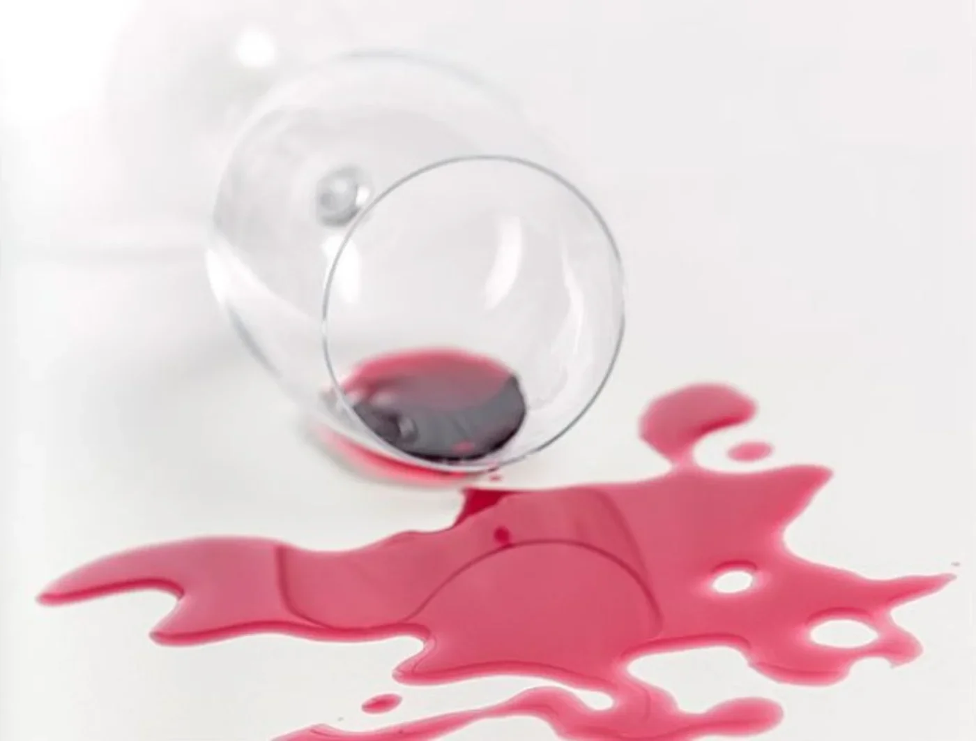 Red wine spilled on a white surface