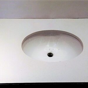 Unimarble Pure White worktop with integrated sink in a modern kitchen