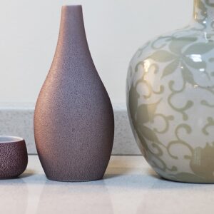 Decorative vases on Unistone Bianco Galactica Quartz surface