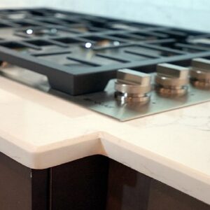 Close-up of Unistone Carrara Misterio quartz worktop with grey veins