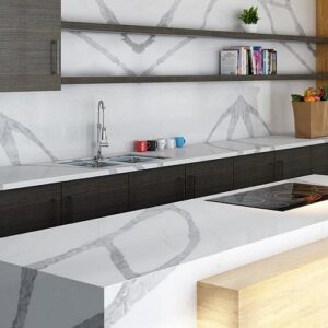 Modern kitchen with Unistone Calacatta Toscane Quartz worktop and dark cabinets.